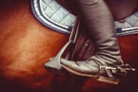 View of a horseback rider's boot in a stirrup