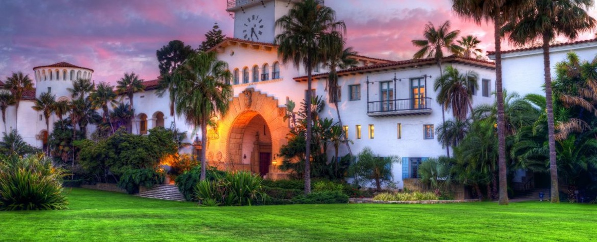 a photo of the courthouse at sunset, it is just one of the many historic landmarks that you will find in Santa Barbara!